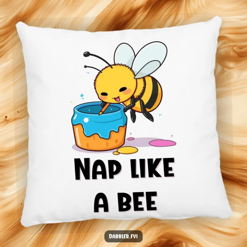 Funny busy bee pillow, artistic bee dipping stinger in paint pot, cozy home decor, comfortable and humorous gift for art lovers.