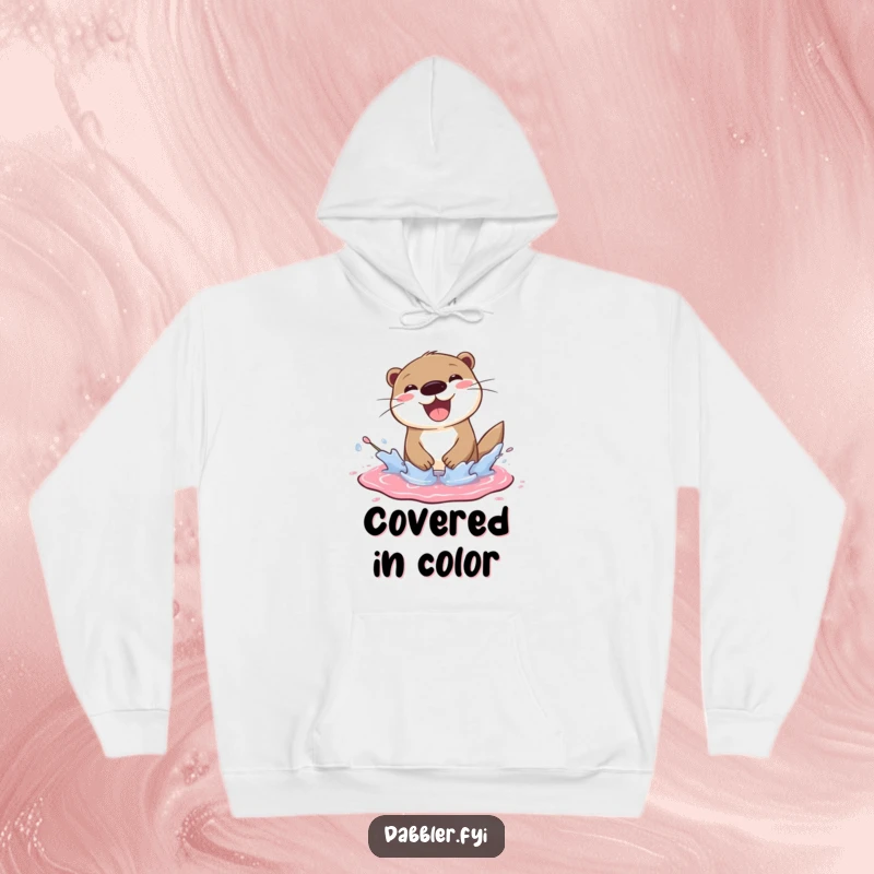 Funny otter hoodie showing a cheerful otter splashing joyfully in a paint puddle, a cozy funny gift.