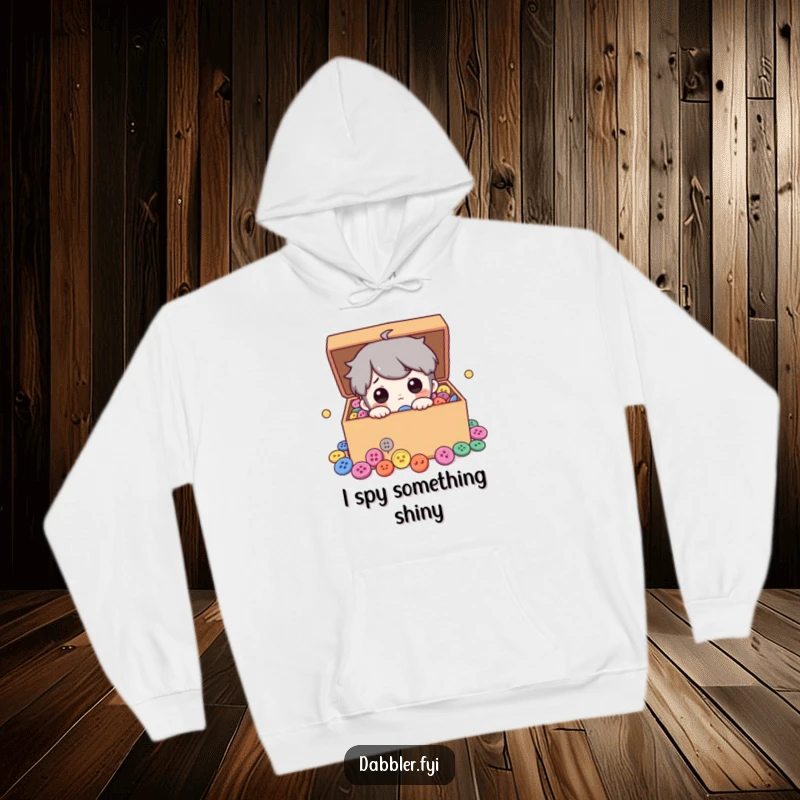 Funny hoodie design of a curious character intently peeking into a treasure chest filled with dazzling colorful buttons, perfect for cozy crafting.