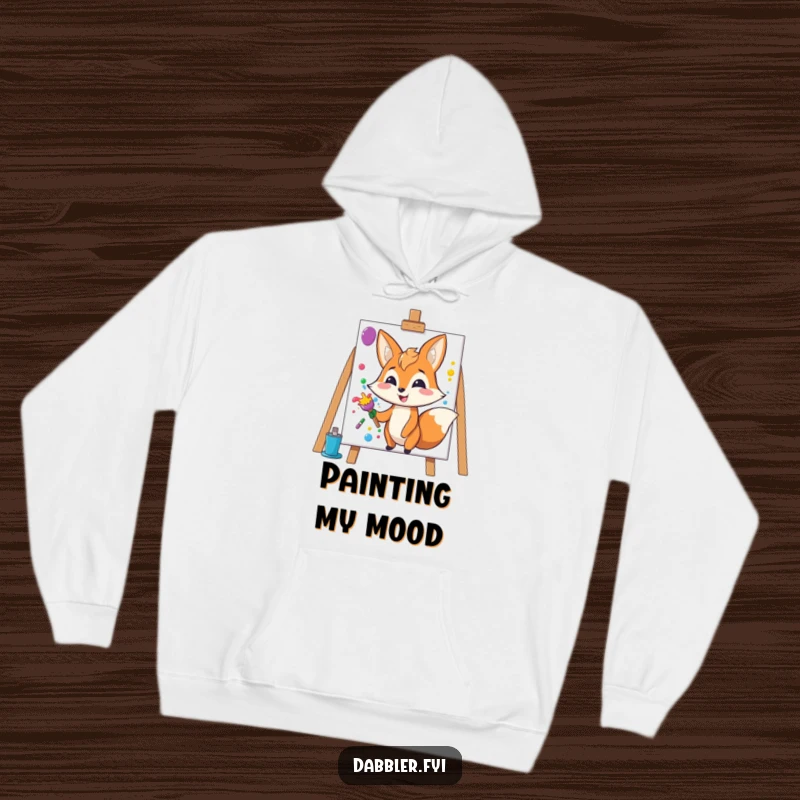 Funny Fox Hoodie: Happy fox character splashes colorful paint onto a blank canvas, cozy and artistic.