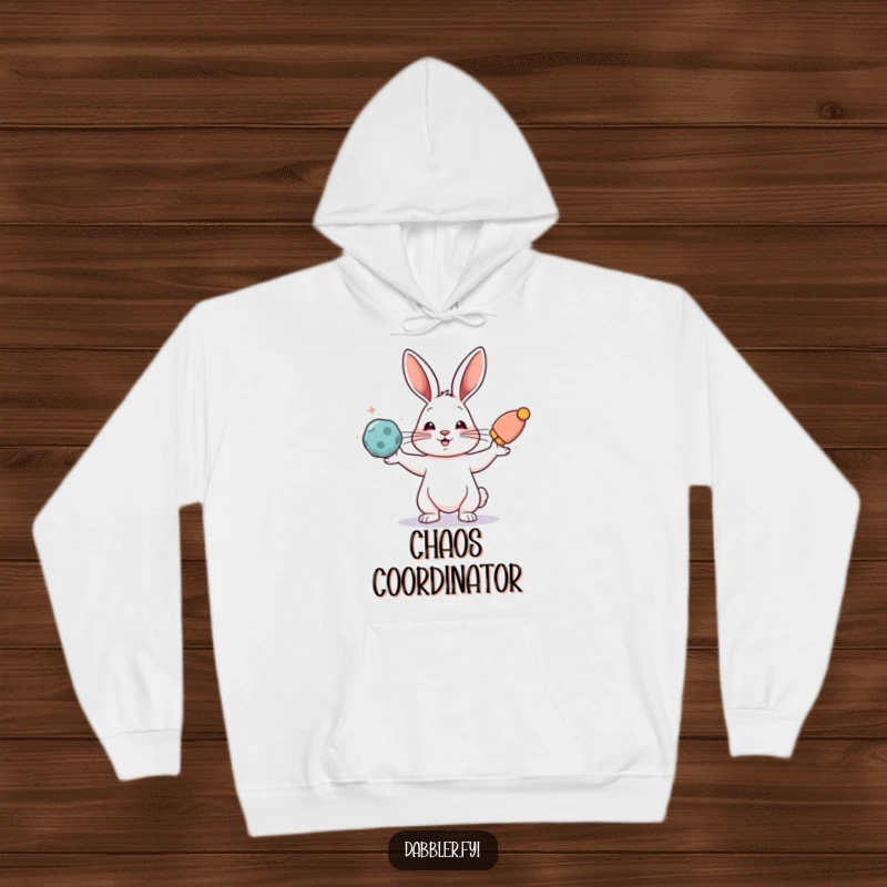 Funny hoodie depicting a rabbit adeptly juggling various colorful objects, offering warmth and humor.