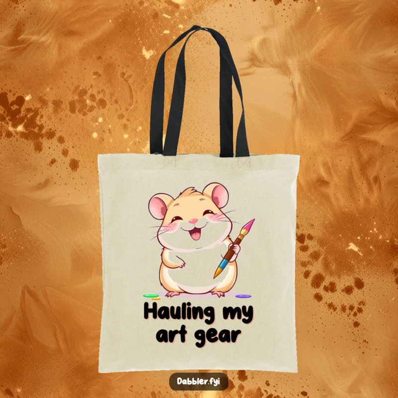 Funny hamster tote bag featuring a giggling hamster gleefully trying a new paintbrush, a stylish funny gift.
